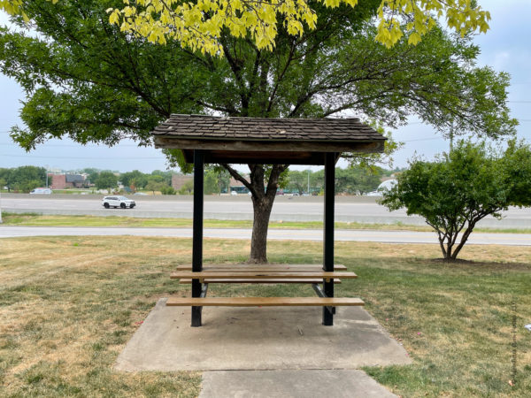 picnic table with shelter with I35 in background