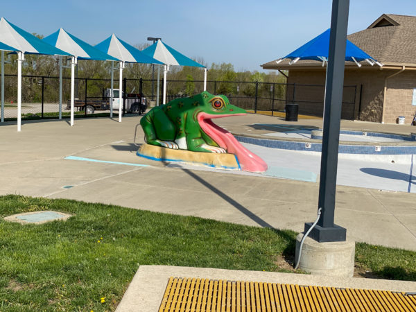 little kid frog slide at the water play area