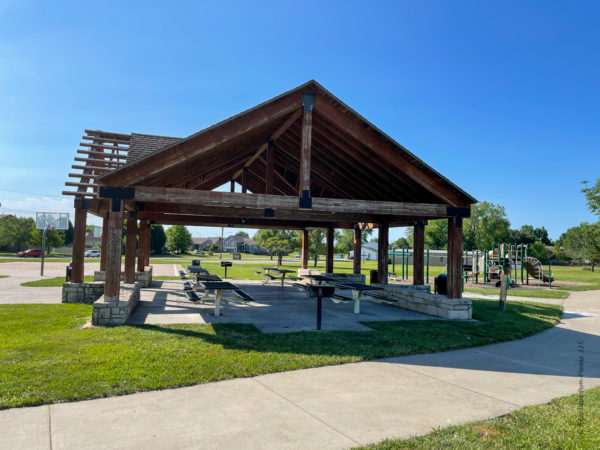 picnic tables, shelter, and grill at veterans memorial 