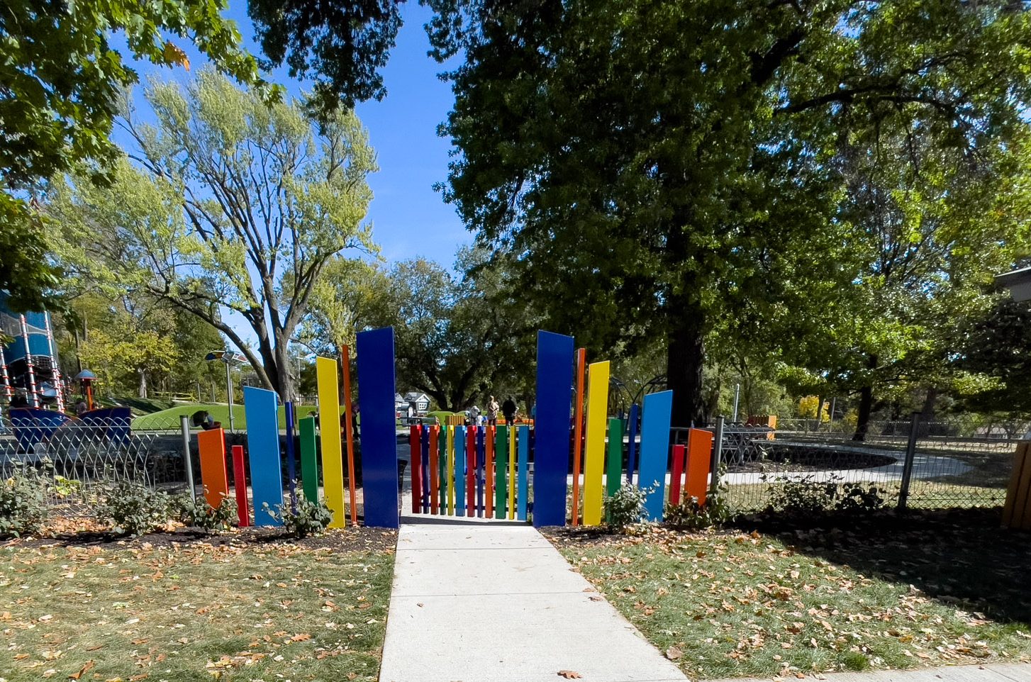 front gate of Strang park colorful blue, yellow, orange panels