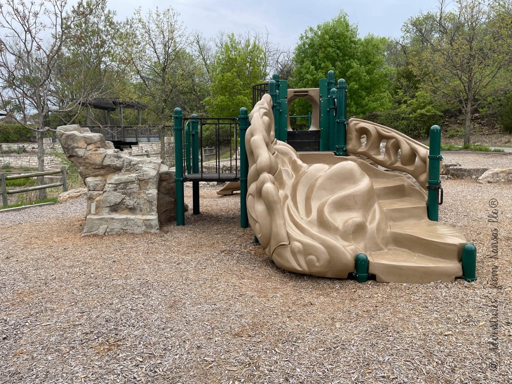 south playground at black hoof lake lenexa with stairs and rock feature.